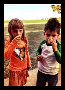 Giada Coldani and Dylan Kerns tasting some fresh milled EVOO